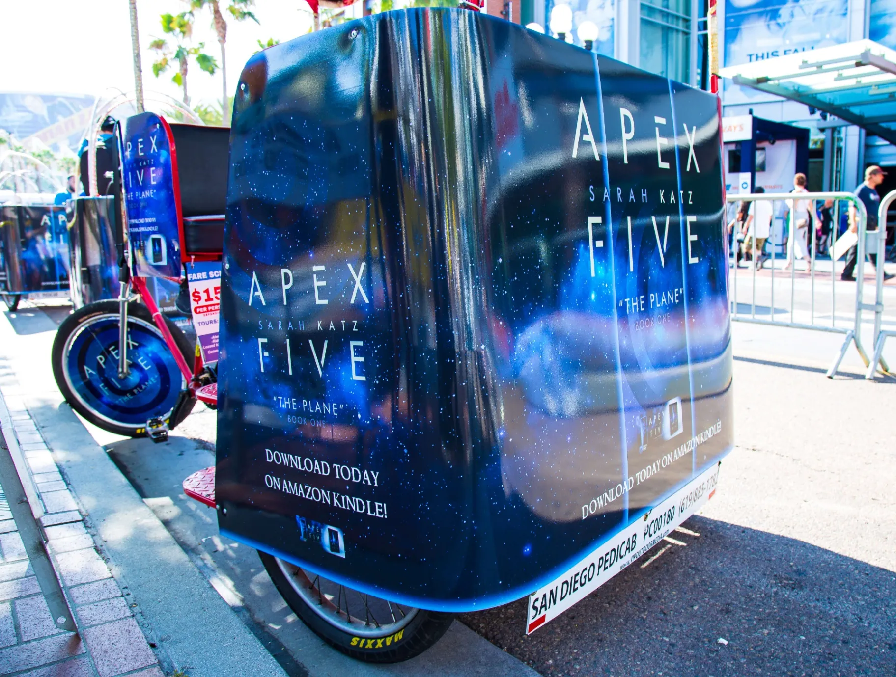 Apex Five pedicab wrap detail showing book cover at Comic-Con