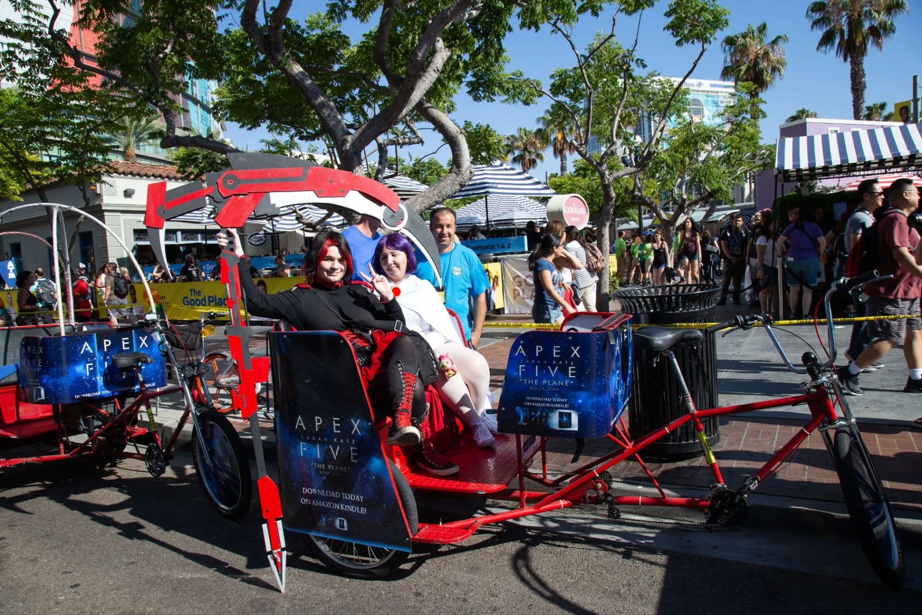 Cosplayers riding Apex Five branded pedicab with custom build at Comic-Con