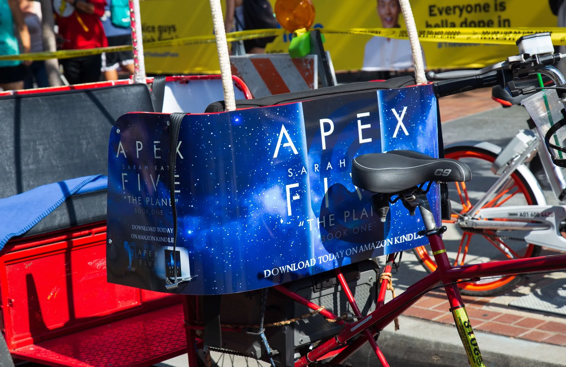 Apex Five pedicab wrap close-up on bike panel at Comic-Con