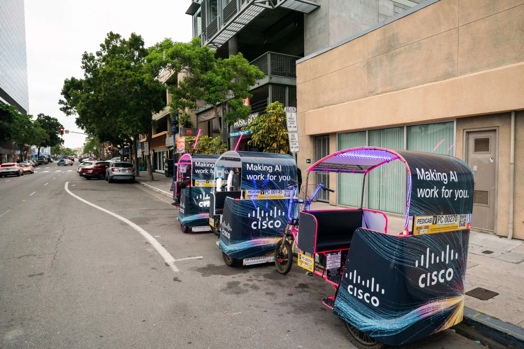 Fleet of Cisco branded pedicabs lined up on San Diego street for convention advertising campaign