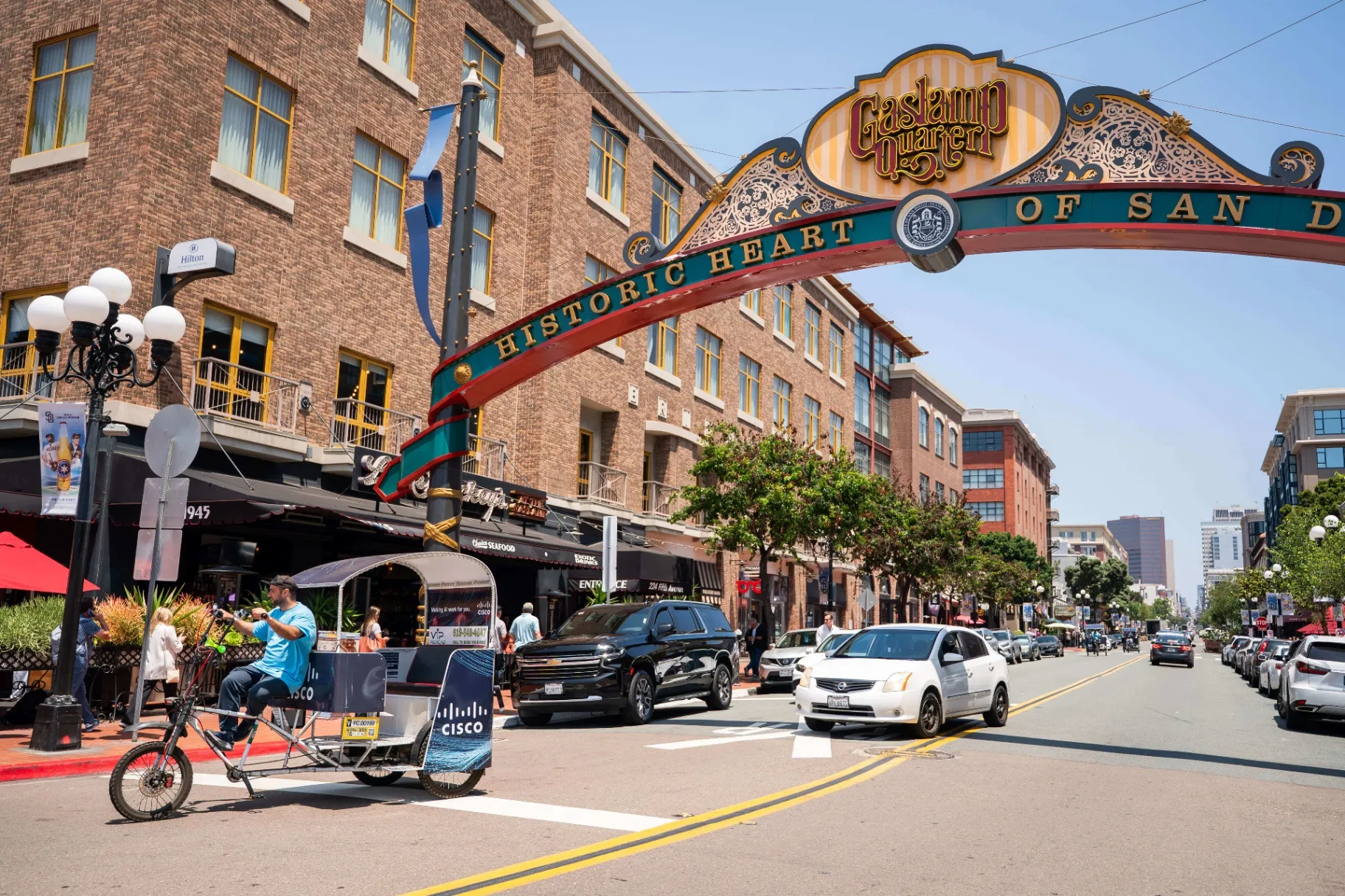 Cisco branded pedicab under the historic Gaslamp Quarter arch in Downtown San Diego