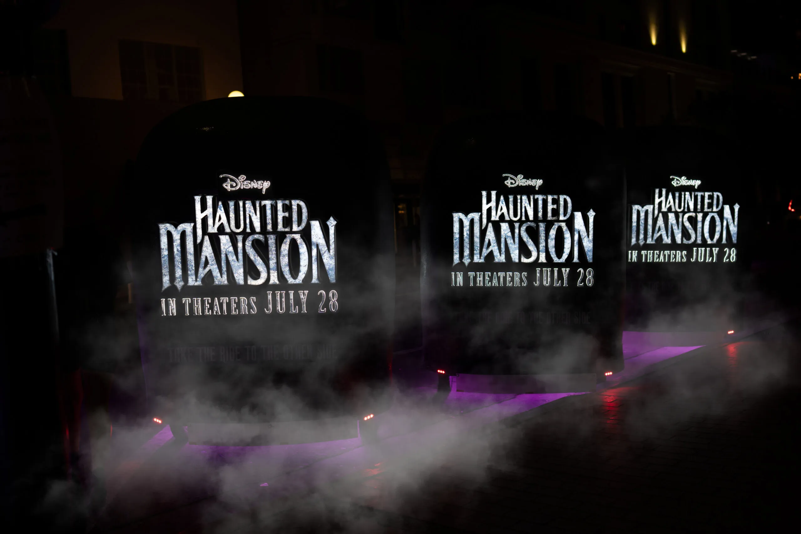Haunted Mansion Doom Buggy pedicab with rear illuminated movie branding at San Diego Comic-Con
