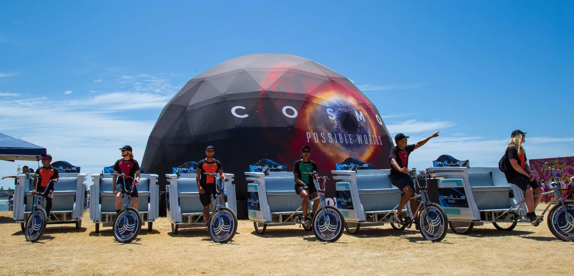 Wide shot of Orville campaign fleet staged at COSMOS experiential dome