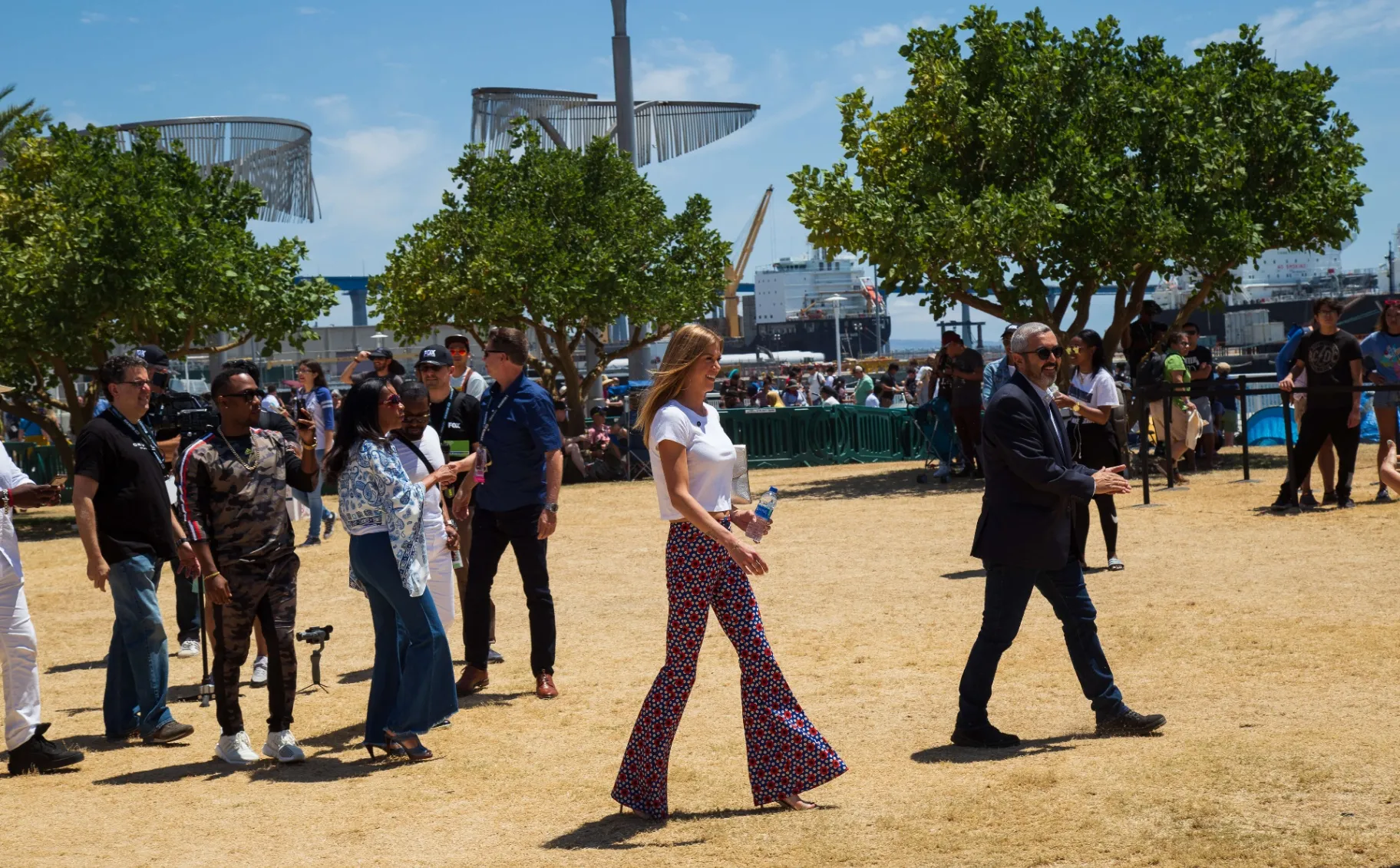 Public figures walking through COSMOS activation grounds at Comic-Con