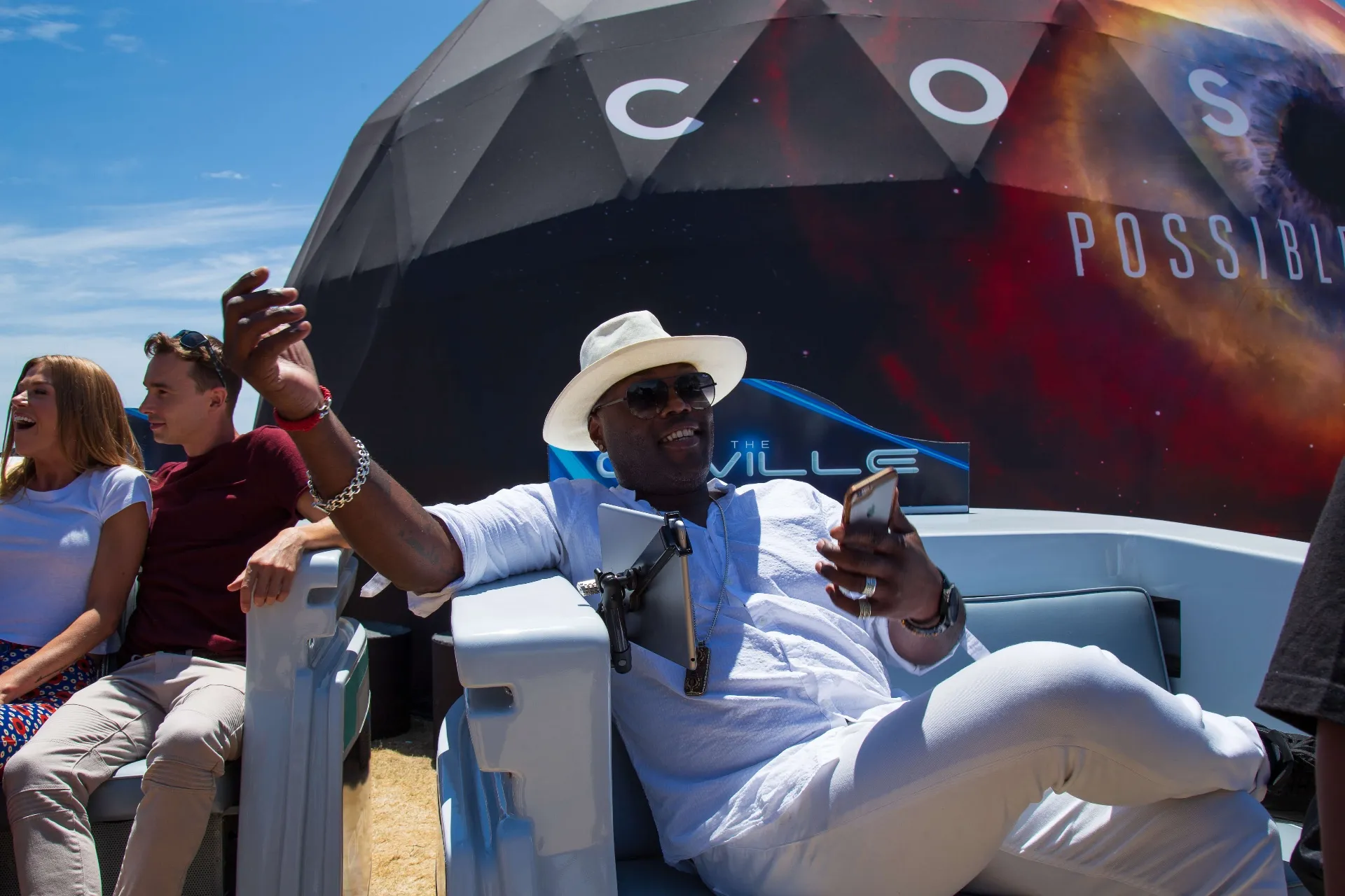 Guest selfie moment inside Orville pedicab during COSMOS event