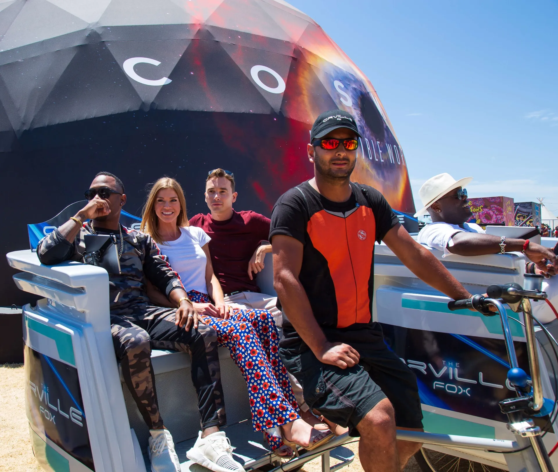 Group portrait with Orville pedicab and COSMOS dome backdrop