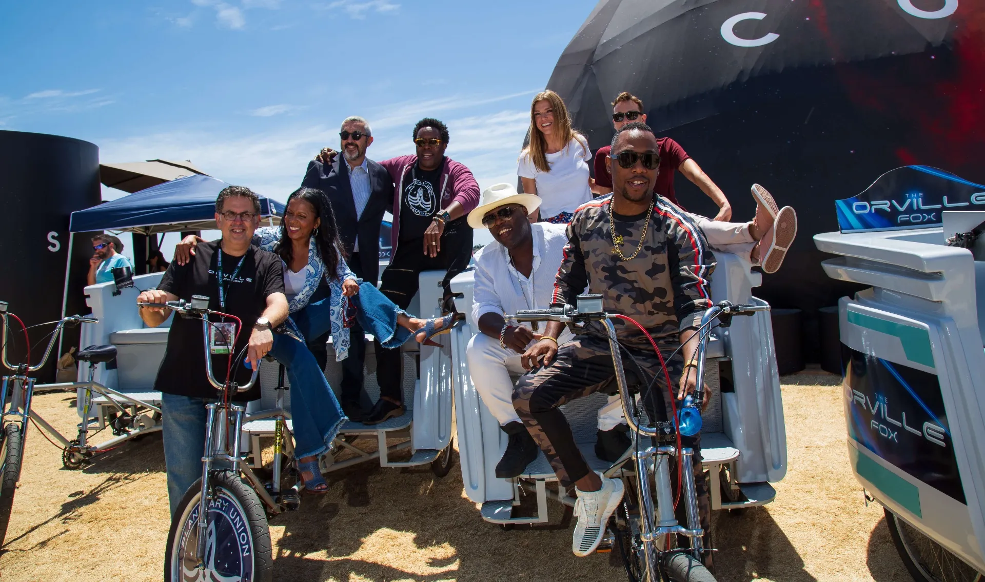 Full Orville cast and team group shot with pedicab fleet at COSMOS dome