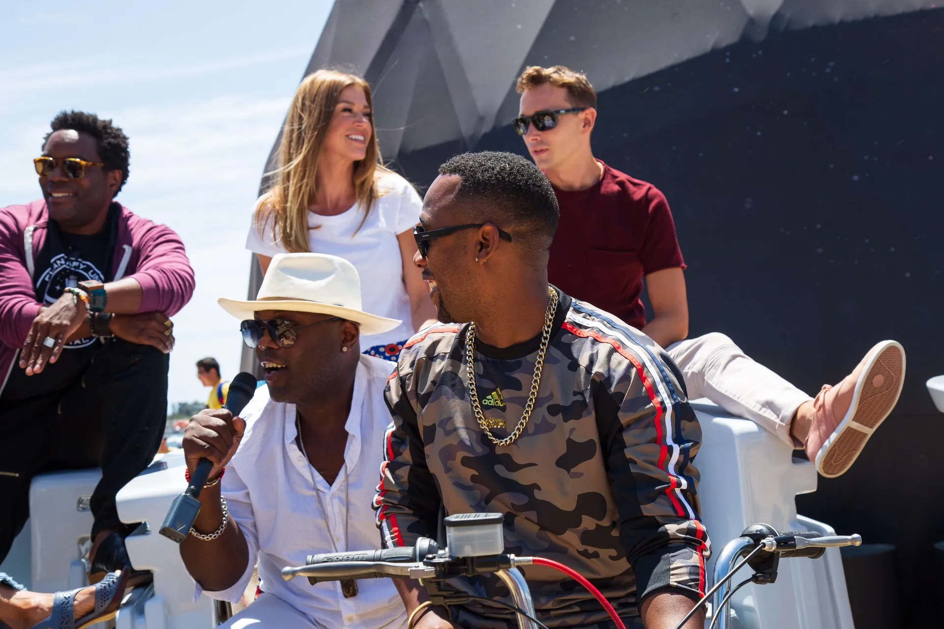 Orville cast close-up laughing on pedicab at COSMOS activation