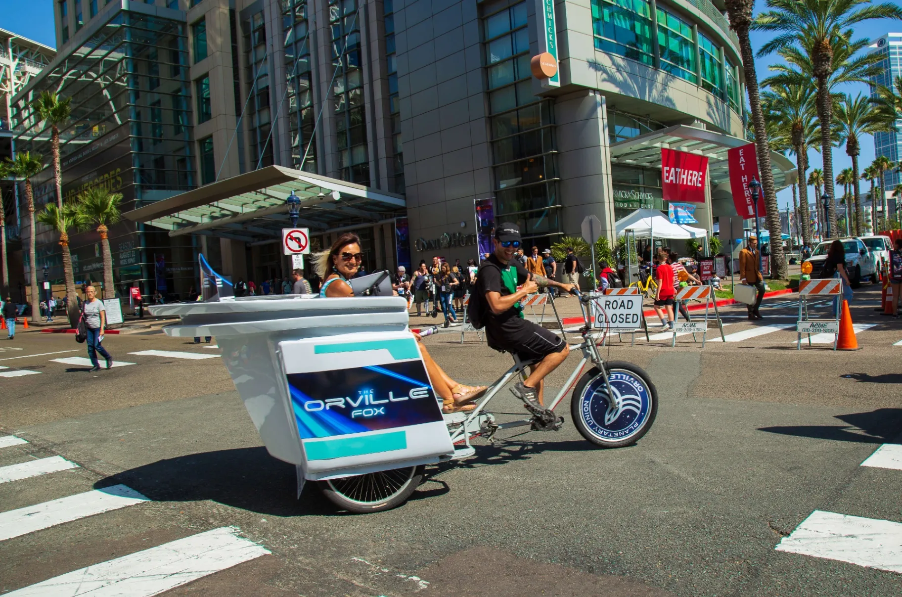 The Orville FOX pedicab with passenger riding through Gaslamp District