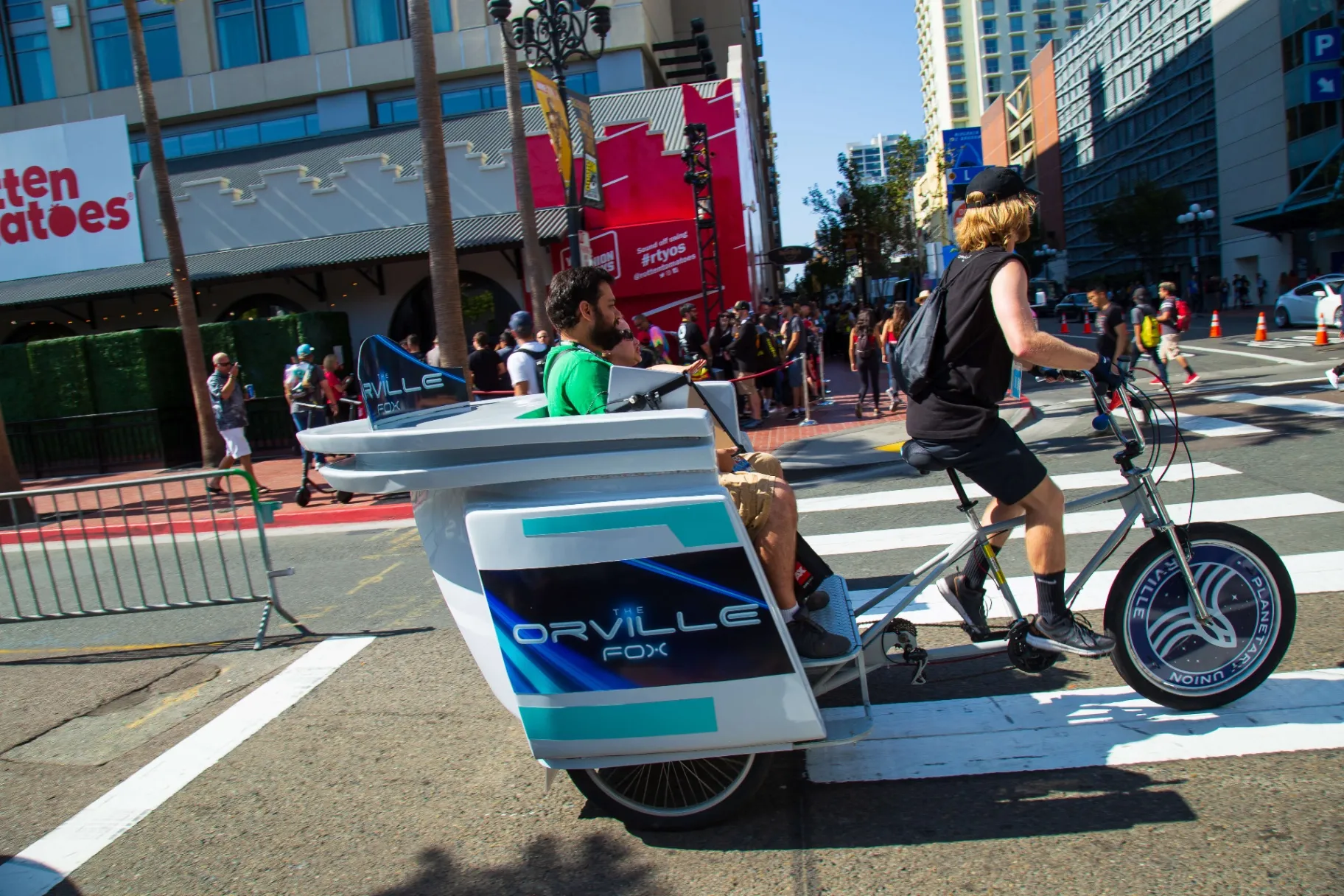 The Orville FOX branded pedicab with Planetary Union wheel covers at Comic-Con
