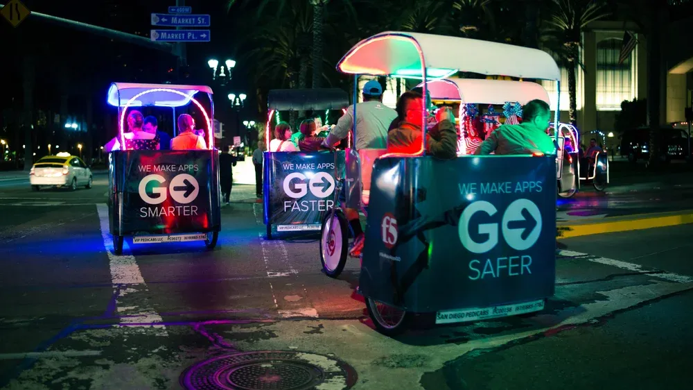 Electric pedicab with mobile billboard wrap for convention sponsorship
