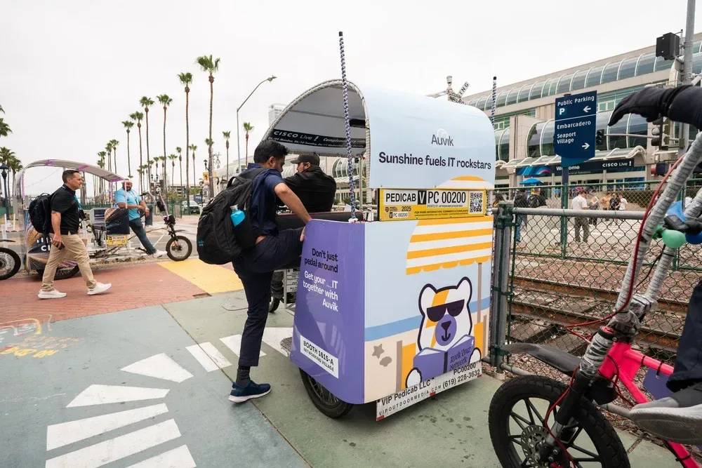 Wrapped electric pedicab working as a mobile billboard in San Diego